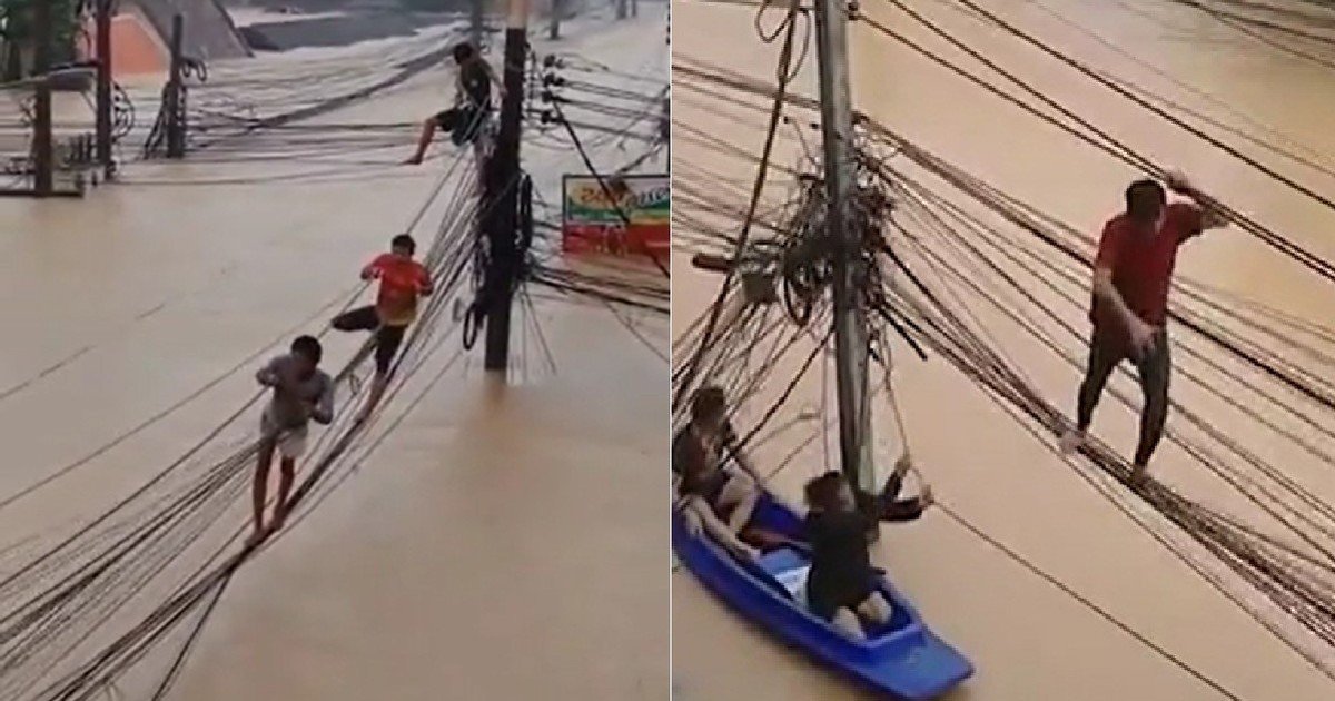 Caminaron sobre cables eléctricos para salvarse de las inundaciones que azotan Tailandia: el video